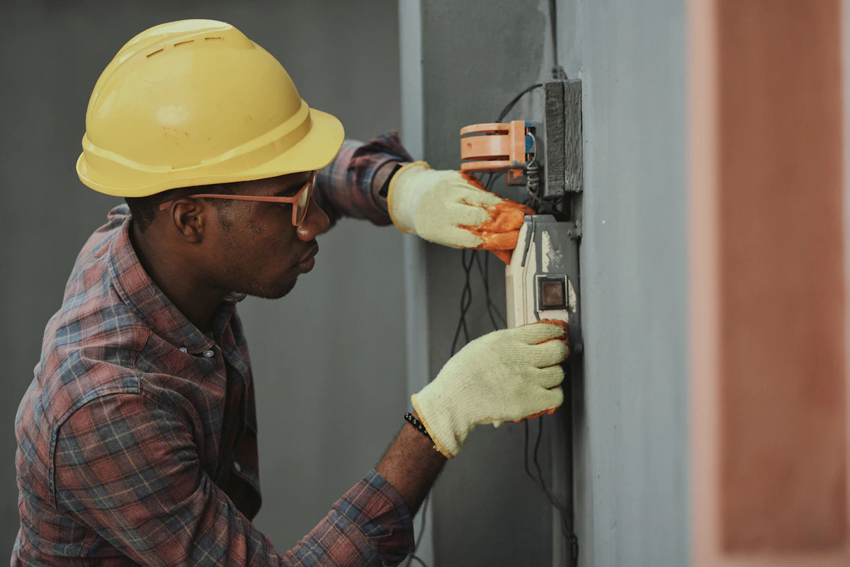 Irrigation technician diagnosing a sprinkler controller and valves